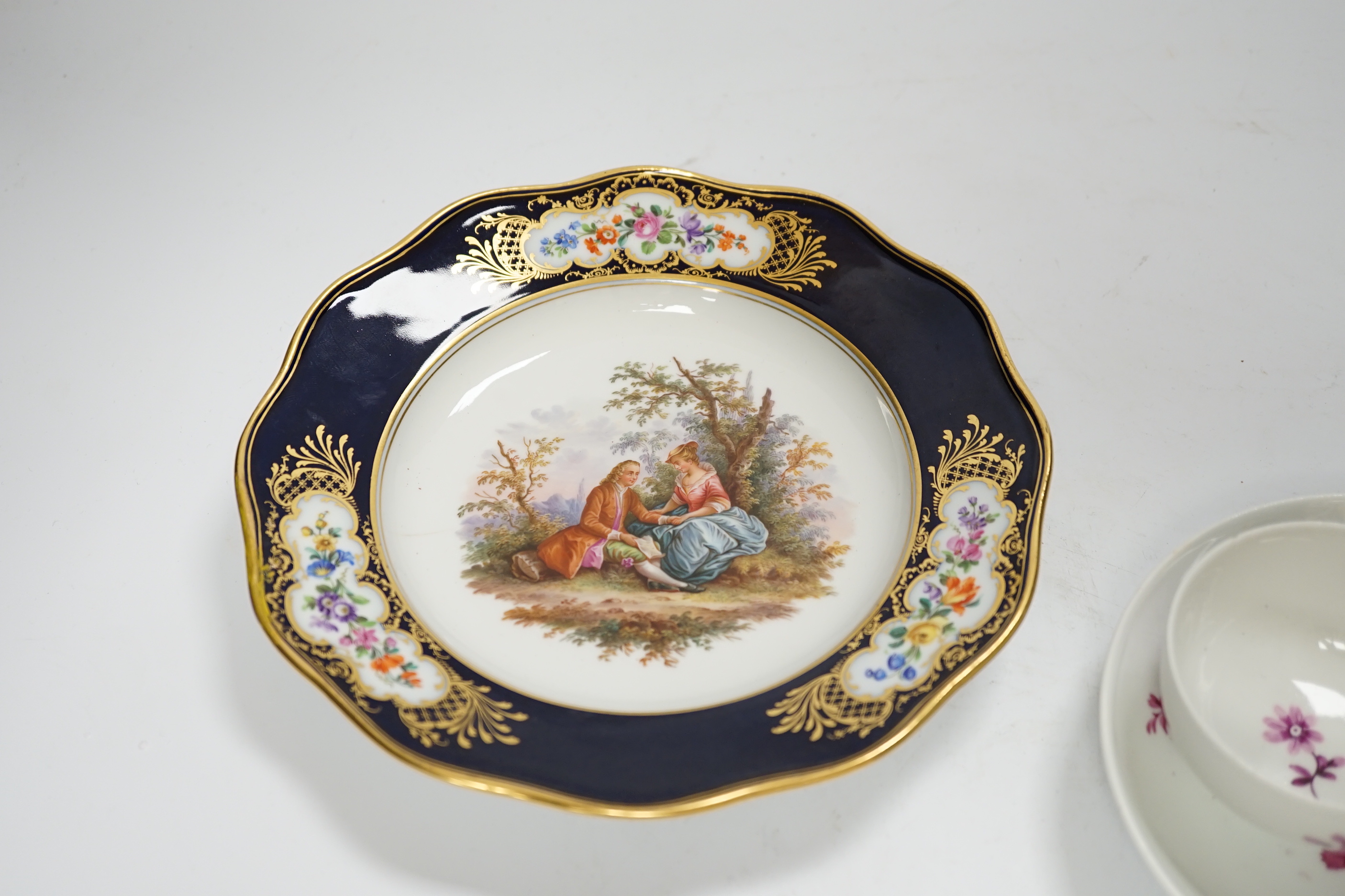 A 19th century Meissen plate and a late 18th century Meissen tea bowl and associated saucer, plate 20cm